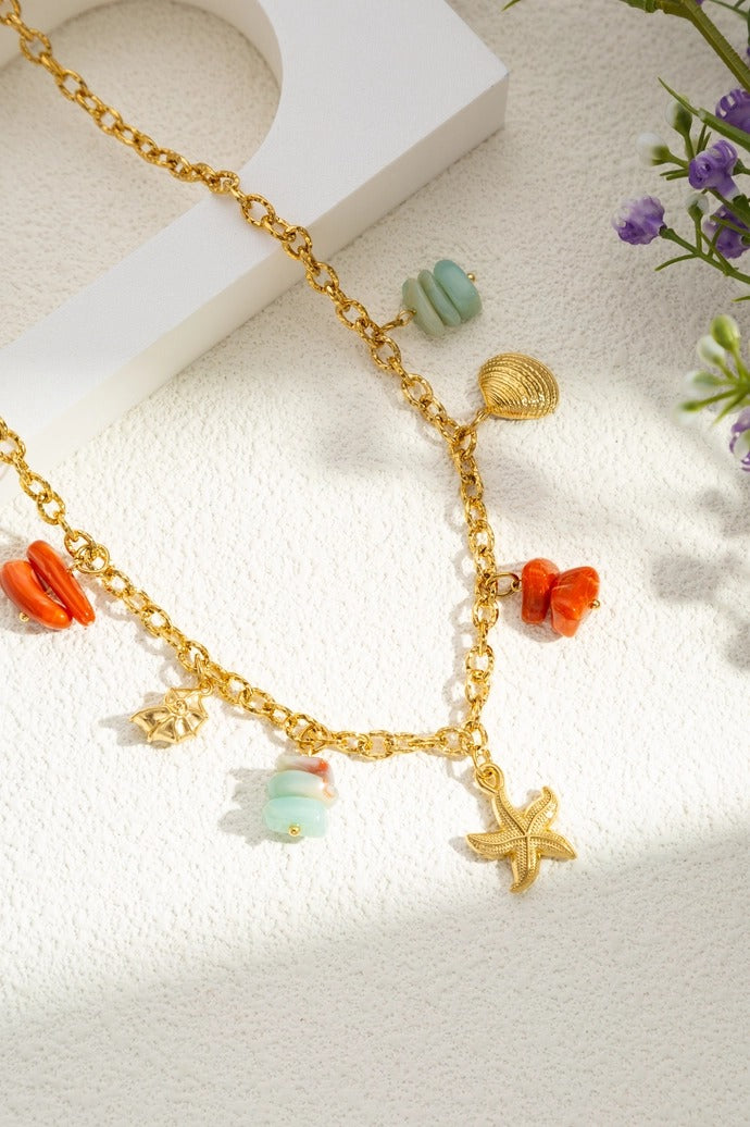 Coral charm ketting - goud